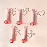 Tube de gloss sphérique avec couvercle à vis, tube cosmétique à air comprimé avec chaîne, tube de crème pour les yeux avec applicateur en silicone souple