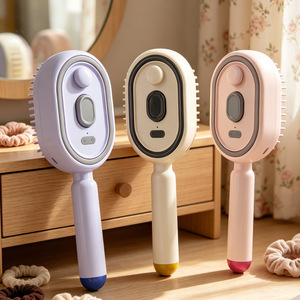 Peine Eléctrico para Masaje del Cuero Cabelludo con Tecnología de Vibración para el Cuidado del Cabello e Hidratación en Colores Morado, Rosa y Beige - Product Image 1