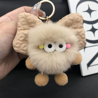 Accessoires de porte-clés : Breloque en fausse fourrure pelucheuse, nœud rembourré doux, boule de charbon écologique, porte-clés promotionnel personnalisable