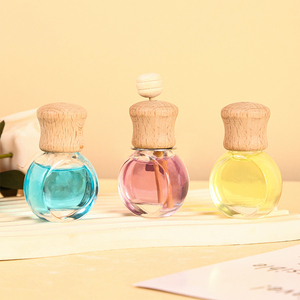 Botella de Perfume colgante para coche, Clip de ventilación transparente para coche, difusor de Perfume, tapa de madera, difusor de coche, ambientador de Perfume de vidrio - Product Image 1