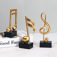 Ornements en résine de style européen en forme de notes de musique (note de portée haute), statue, trophée, décoration pour salle d'exposition de piano et salle de formation