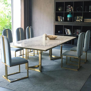 ชุดโต๊ะรับประทานอาหารเฟอร์นิเจอร์บ้านกระจกสีขาวและสีทองชุดโต๊ะรับประทานอาหารสุดหรูชุดโต๊ะอาหาร4เก้าอี้ - Product Image 1