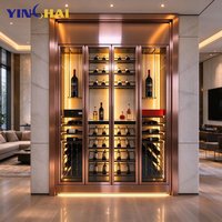 Armoire à vin isotherme personnalisée en acier inoxydable or rose avec dessus sculpté ajouré et porte vitrée