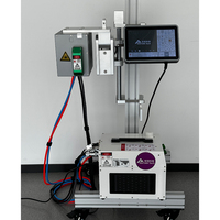 Imprimante laser UV Machine de codage de date d'expiration de numéro de lot Machine de marquage laser en ligne de boîtes de papier de bouteilles rondes