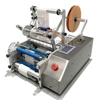 Machine d'étiquetage d'autocollants de bouteille ronde semi-automatique de table très polyvalente