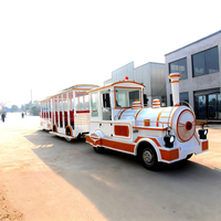 Train électrique rétro sans rails en acier moderne pour parcs d'attractions, visites touristiques, centres commerciaux et jeux de divertissement en extérieur, à vendre