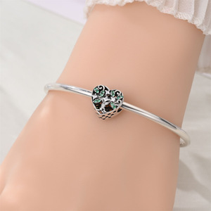 A green and white brass pendant featuring the classic four-leaf clover and heart motif, perfect for women - Product Image 6