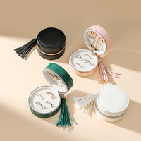 Luxueux moderne Mini ronde en cuir PU Portable fermeture à glissière boîte à bijoux de voyage avec gland
