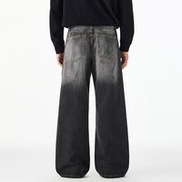 Jeans délavés tendance style américain avec motif encre rétro, coupe ample et droite, en denim