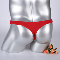 Sous-vêtements pour homme en nylon respirant tissé à basse taille, style tanga, en soie glacée, tissage uni, avec poche pour pénis, type avion, séparé