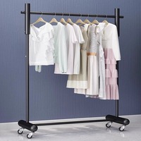 Présentoir mobile moderne en métal écologique sur pied pour magasin de vêtements féminins, idéal pour vitrine, diffusion en direct et chambre