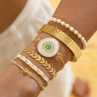 Conjunto de brazalete de ojos malvados azules de estilo exagerado bohemio, pulsera de perlas chapada en oro para mujer, joyería de moda