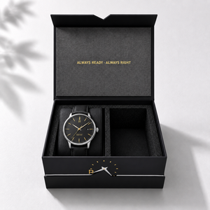 Montre pour homme avec cadran noir et bracelet en cuir, dans un coffret rigide haut de gamme avec logo en feuille d'or et fermeture magnétique - Product Image 1