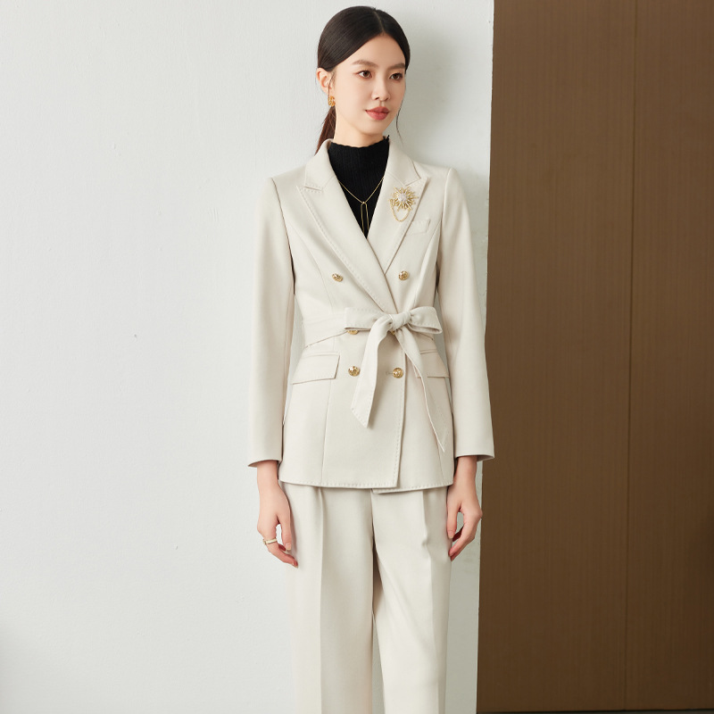 White suit trousers brooch