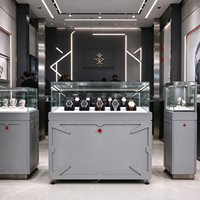 Vitrine de présentation de montres en métal gris avec dessus en verre industriel, éclairage LED, bouton rouge, CE ETL pour magasin de montres