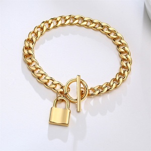 สร้อยข้อมือดีไซน์เนอร์ OT Clasp Lock Charms  วัสดุสแตนเลสสตีล 316L  แบบ Cuban Miami Link Chain สีทอง - Product Image 1