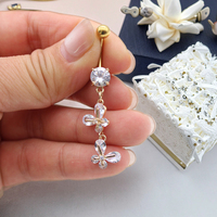 Xinfocus 2026 Nouvelle conception Anneaux de nombril en cristal Acier inoxydable Piercing de nombril Plaqué or Bijoux de corps pour femmes et hommes