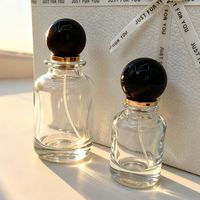 Flacon de parfum en verre cylindrique d'inspiration vintage avec pulvérisateur à pompe circulaire, atomiseur à pression, vente en gros, directement de l'usine