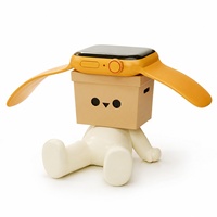 Support de charge pour montre en résine créative en forme de figurine assise avec fente de 4,1 cm pour bureau, vente en gros et présentation au détail