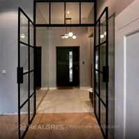 Porte battante en verre avec cadre en acier Realgres, bordure ultra-fine, verre trempé transparent, porte de suite d'hôtel