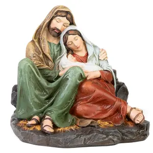 Statue de table couleur résine représentant les parents de Jésus tenant la Nativité