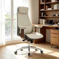 Chaise de bureau exécutive en cuir, dossier haut, pivotante, réglable, avec structure en chrome poli et support lombaire