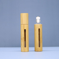 Sortie d'usine 10ml rouleau de verre de coquille de bambou sur des bouteilles pour les huiles essentielles avec des boules de rouleau d'acier inoxydable