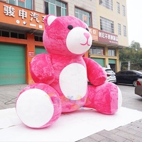 Mascotte géante de la Saint-Valentin en forme d'ours en peluche rose gonflable pour la décoration extérieure.