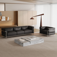 Canapé Corbusier de style européen, minimaliste italien, Bauhaus, noir, une place, luxe léger, en similicuir, avec accoudoirs incurvés et dossier haut