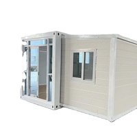 Maison conteneur moderne fonctionnelle à double aile extensible et respirante avec murs épaissis pour hébergement d'urgence sur balcon