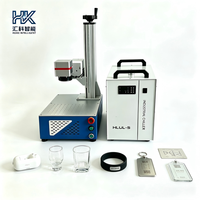 Machine de marquage laser UV de bureau Huike 5W, idéale pour la gravure d'étiquettes sur les flacons cosmétiques en verre et les articles en verre.