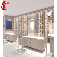Comptoir de présentation de bijoux de luxe avec chaises de consultation, vitrine à bijoux haut de gamme à LED pour l'aménagement de boutiques