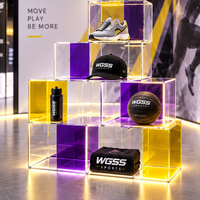 Stand d'exposition personnalisé 10x20 pieds avec boîtes de présentation en acrylique et en-tête de marque haute visibilité pour l'événement sportif 2026