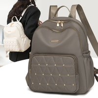 Sac à dos décontracté pour femmes en nylon léger imperméable avec fermeture éclair, design tendance pour un usage quotidien