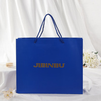 Sac cadeau en carton bleu foncé personnalisé de luxe avec impression de marque, estampage à chaud doré et matériaux recyclés