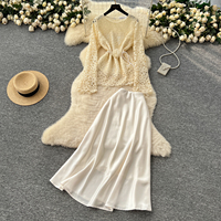 Ensemble élégant de style français pour femmes, haut à manches longues en dentelle avec ceinture à nouer, jupe midi en satin taille haute pour le printemps