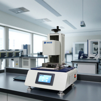 Machine d'essai de testeur de pénétration de liquide de couches et de serviettes hygiéniques et de serviettes prix de machine d'essai de pénétration d'équipement