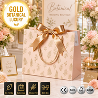 Sac cadeau en papier rose pêche avec logo personnalisé, imprimé botanique doré, poignée en corde métallique, nœud en satin, luxe, écologique, vente en gros