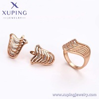 Ensemble de bijoux fantaisie XUPING en or rose avec cristaux ondulés, bague et boucles d'oreilles, style Art Déco, pour un usage quotidien