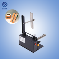 Machine portative de rebobinage de rouleaux d'étiquettes adhésives et d'étiquettes autocollantes de codes à barres