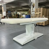 Table de soin électrique haut de gamme en cuir PU pliable et portable pour hôtels et salons de beauté, avec excellente capacité de rangement
