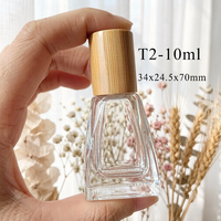 Flacons roll-on en verre transparent de 10 ml de forme spéciale haut de gamme, flacons de luxe pour huiles parfumées, bouchons en bambou, bille roulante en acier inoxydable