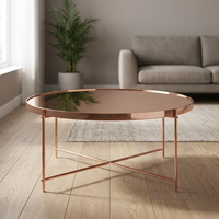 Table basse ronde super tendance avec plateau en verre et structure en métal, design minimaliste pour le mobilier de salon