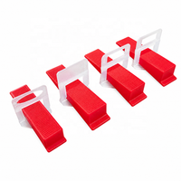 Système de nivellement de carreaux auto-bloquant rouge avec insert en forme de cale de 2,0 mm pour une installation facile et un contrôle de l'écartement des carreaux en céramique et porcelaine