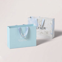 Sacs en papier personnalisés de luxe pour vêtements, sacs cadeaux noirs, sacs d'emballage pour le shopping avec poignées pour vêtements