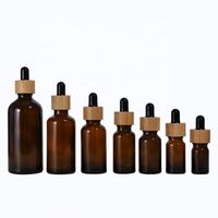 Bouteilles d'huile essentielle en verre ambré rond écologiques vides de 5 ml à 100 ml avec bouchon compte-gouttes en bambou, échantillons gratuits, MOQ 50