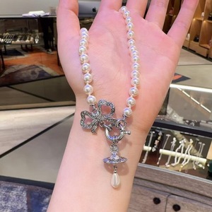 Nouveauté été : Collier de luxe abordable pour femme, style Western, en tungstène plaqué or, avec pendentif Orb Planète, nœud, goutte d'eau et perle - Product Image 4