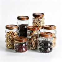 Bocaux de conservation en verre borosilicate côtelé en gros avec couvercle hermétique en acacia pour grains de café, noix, pâtes et épices