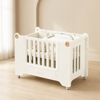 Lit bébé multifonctionnel 4-en-1 pour cododo avec station à couches et roulettes, vente en gros, OEM ODM
