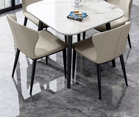 Ensemble de table à manger carrée moderne avec chaises rembourrées, plateau en bois gris et blanc, pieds noirs, hauteur réglable, durable, 4 places, pour la salle à manger à domicile